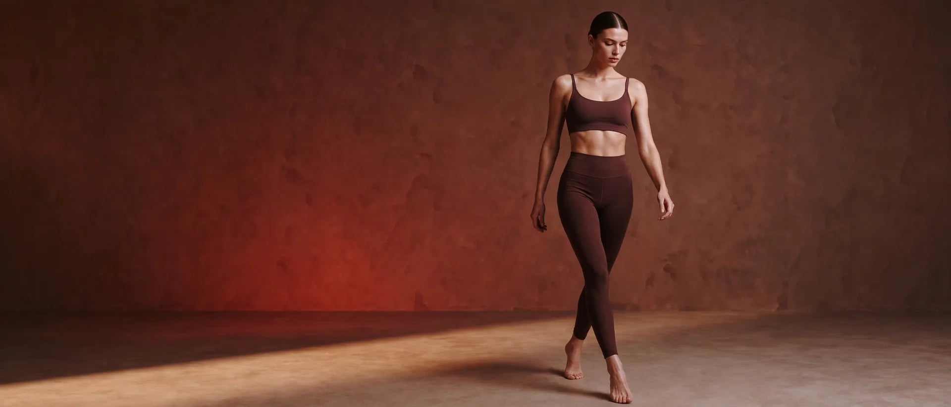NUVRYA studio campaign in deep cocoa performance activewear